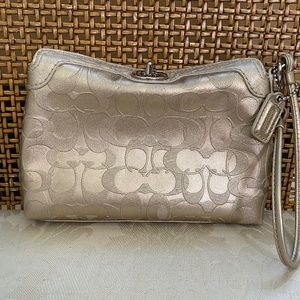 Coach Wristlet in Gold Leather with Embossed logo C